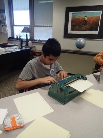A young student named Alijah at the braille challenge typing