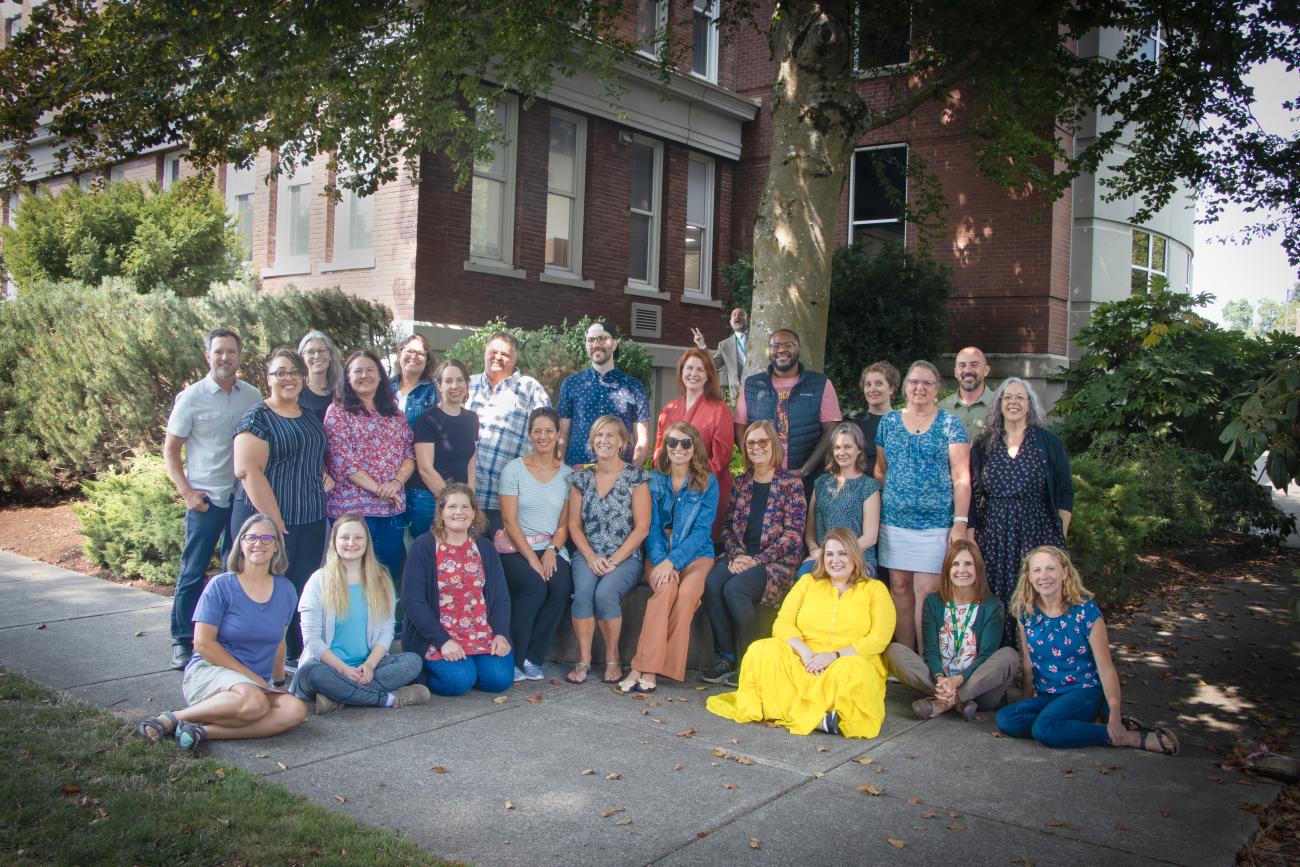 Group photo of Outreach Staff B-21 outside