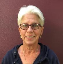 Chris Curatolo, a woman with short gray hair, glass, and inviting smile.