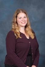 Colleen Johnson, a smiling woman with shoulder length light brown hair and blue eyes.