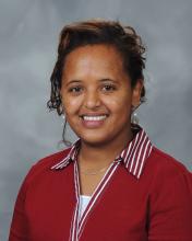 Rahel Tefera: Shoulder slightly to the side, looking straight forward with smile.