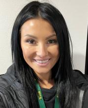 Headshot of Sierra smiling at the camera